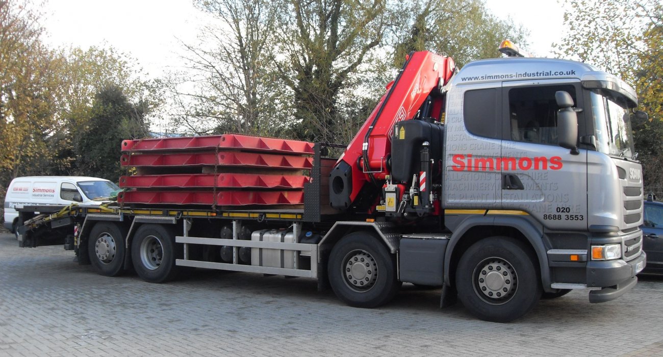 Simmons flatbed truck with crane